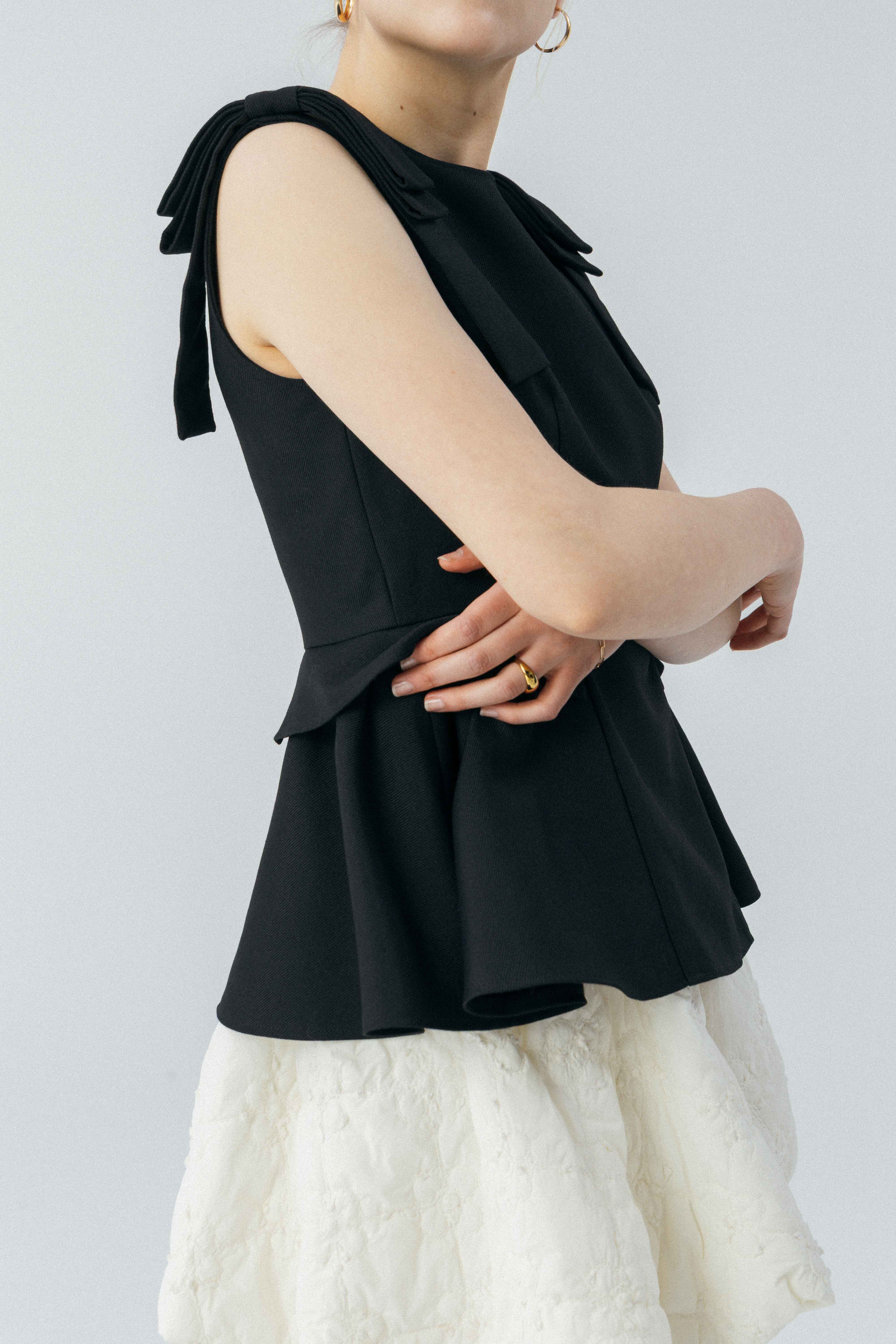 Korinthos Sleeveless Peplum