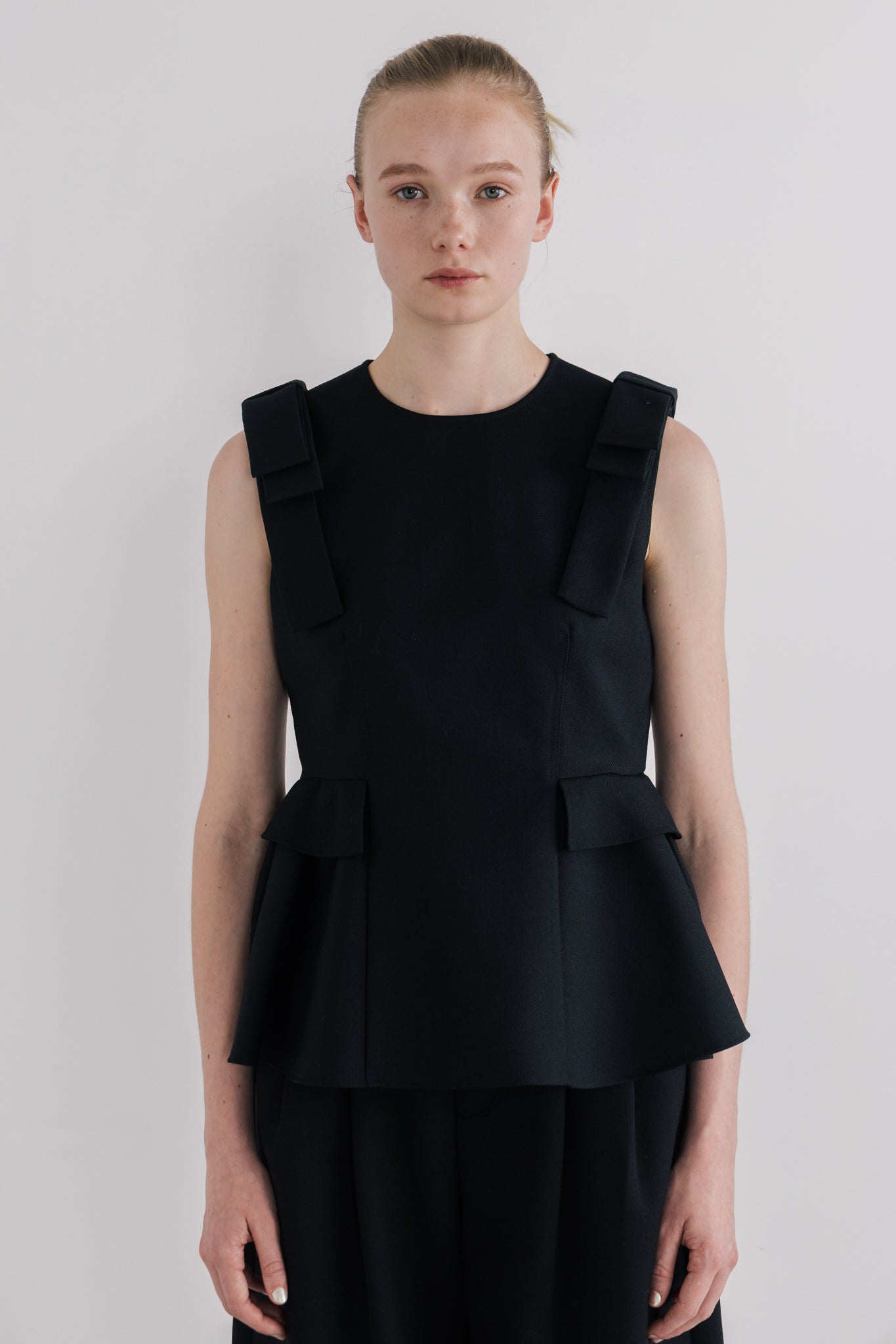 Korinthos Sleeveless Peplum