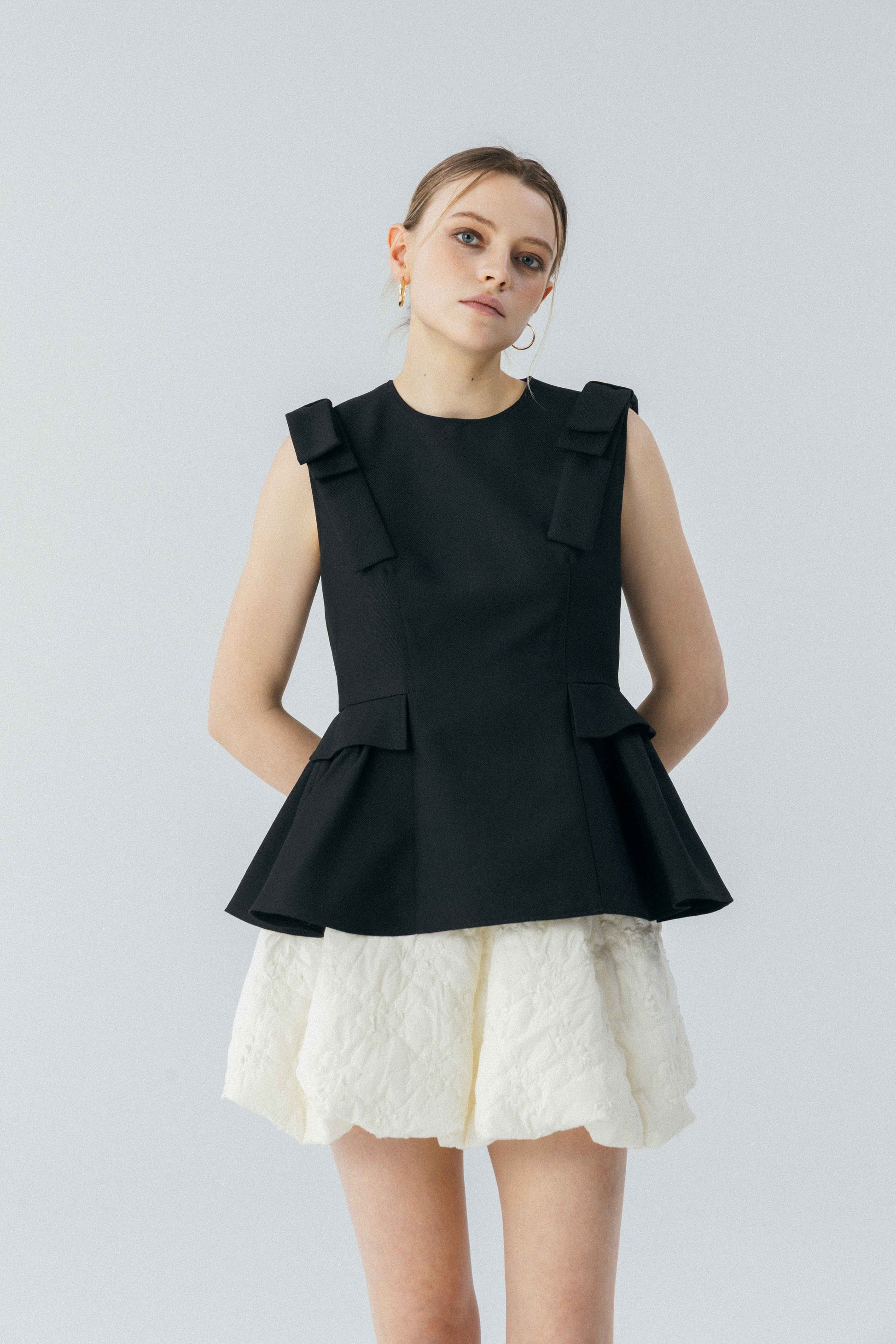 Korinthos Sleeveless Peplum